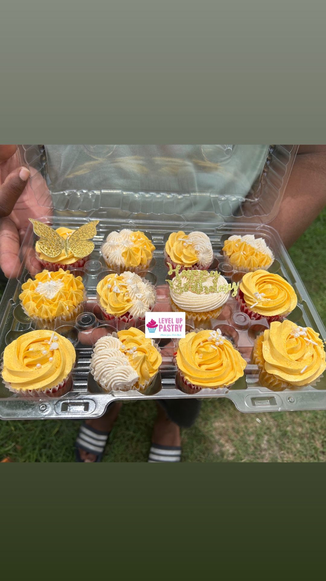 Yellow and ivory celebration cupcakes with gold toppers