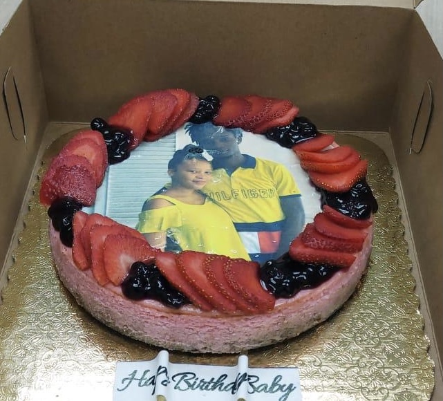 Strawberry cheesecake with an edible birthday image