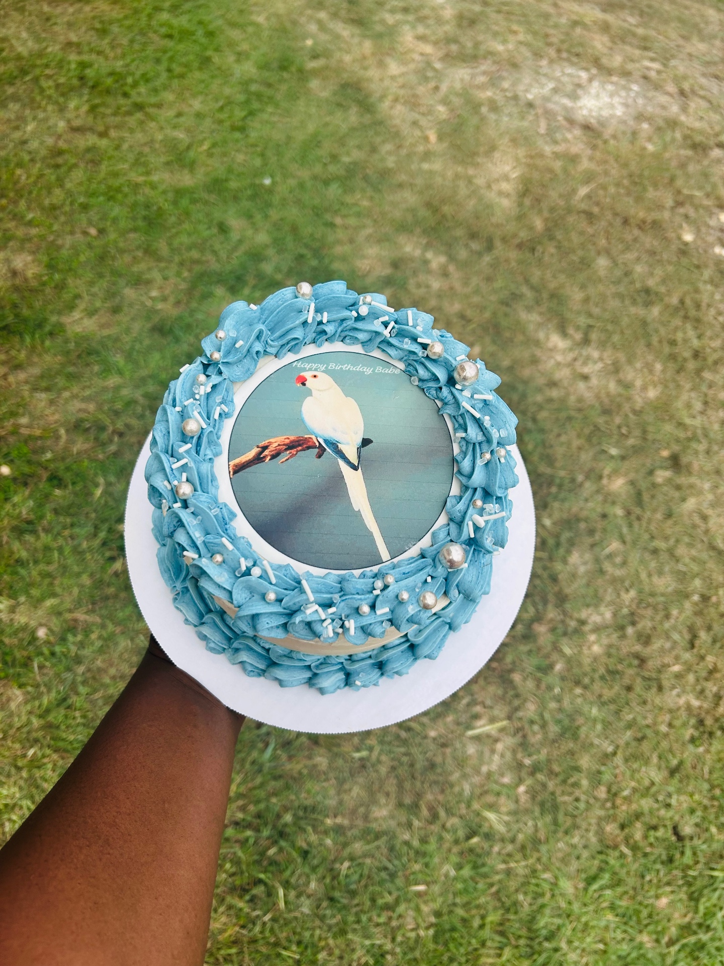 Blue birthday cake with an edible image