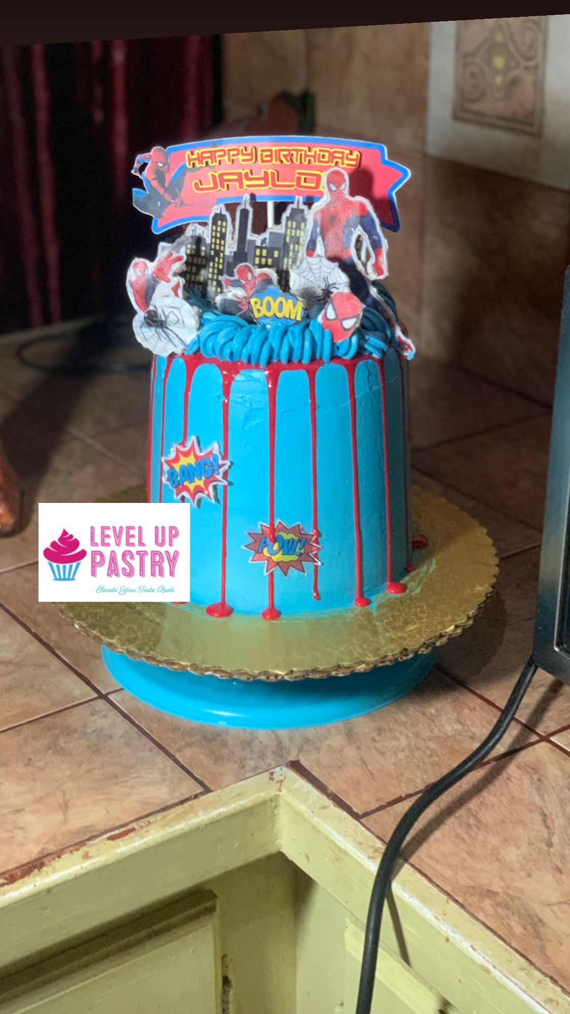 Blue superhero-themed birthday cake