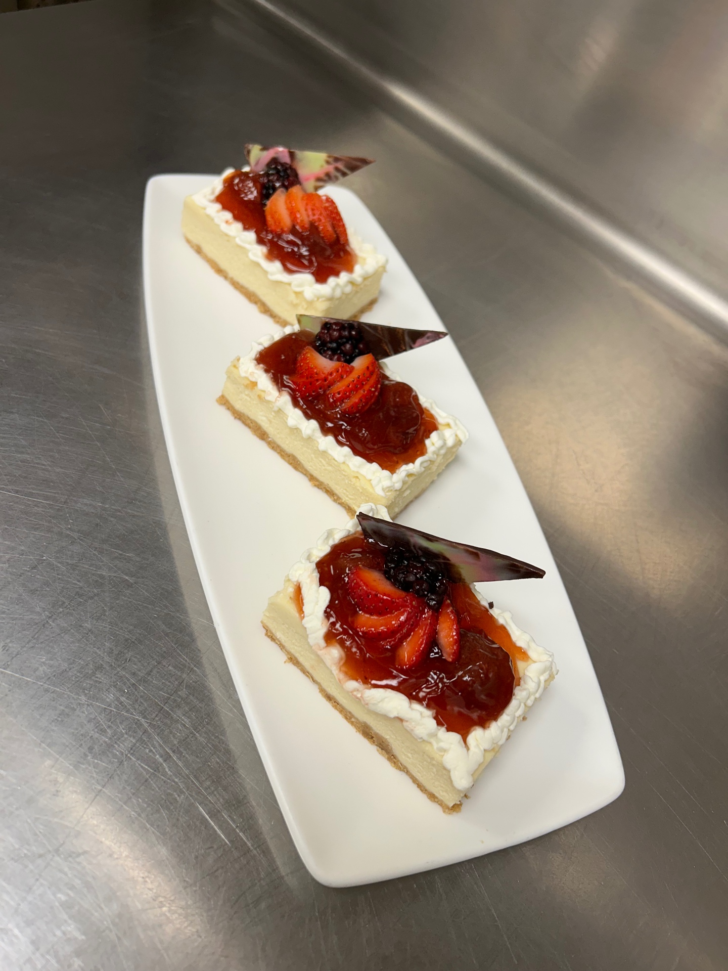 Strawberry-topped cheesecake slices